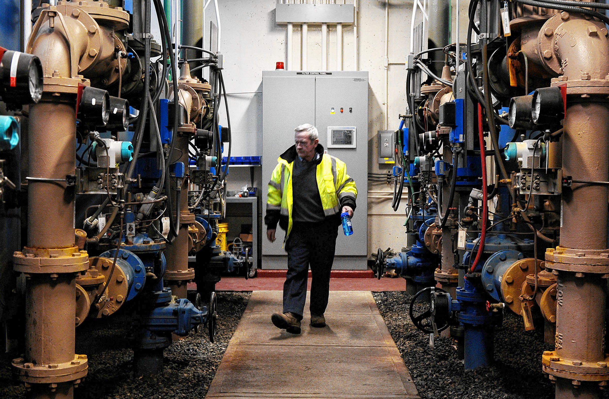 Rich Kenney, chief water systems operator for the Town of Hartford, Vt. leaves the Wilder, Vt., treatment plant to check on a reported leak in a White River Junction, Vt., water line Wednesday, January 22, 2014. (Valley News - James M. Patterson) Copyright Valley News. May not be reprinted or used online without permission. Send requests to permission@vnews.com.