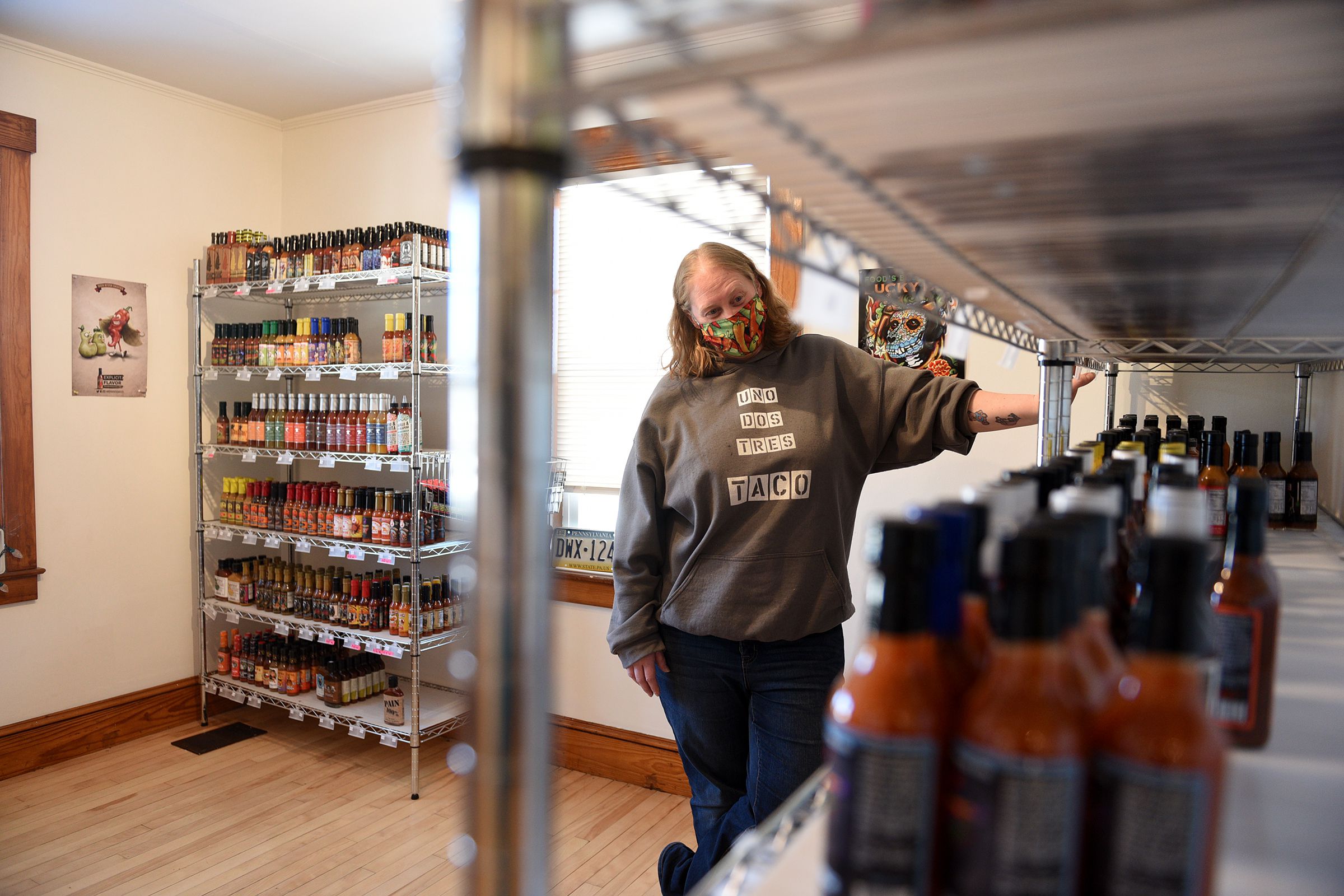 Roberta Parker, who co-owns Angry Goat Pepper Co. with her husband, looks over the inventory at their retail store in White River Junction, Vt., on Friday, Jan. 8, 2020. ( Valley News - Jennifer Hauck) Copyright Valley News. May not be reprinted or used online without permission. Send requests to permission@vnews.com.