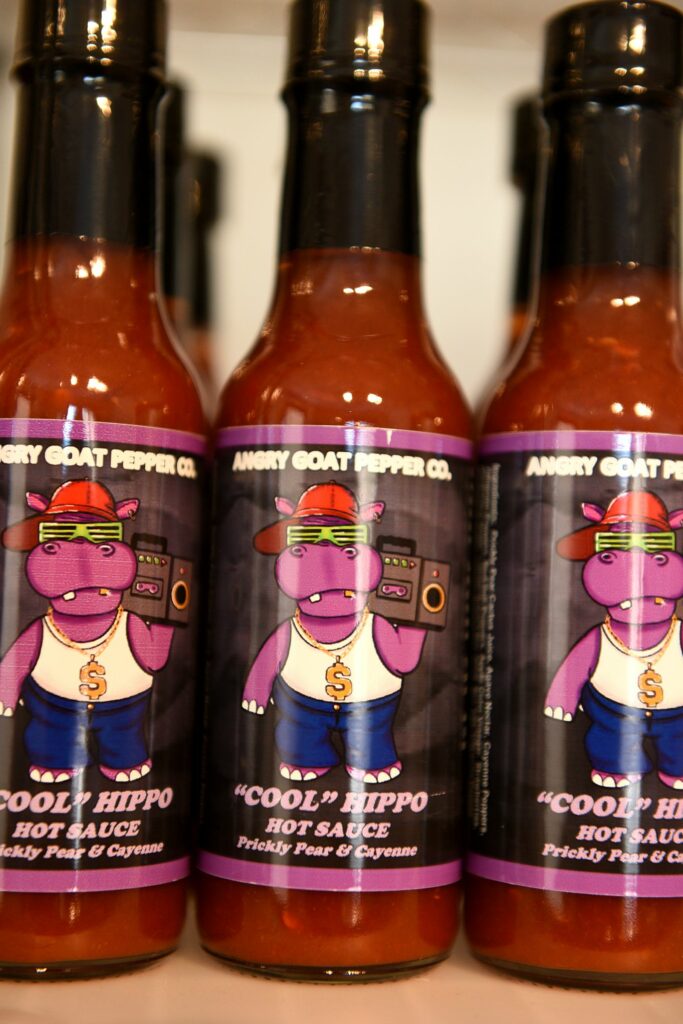 Cool Hippo Hot Sauce, with prickly pear and cayenne, is one of the many products made by Angry Goat Pepper Co. for sale in their retail store in White River Junction, Vt., on Thursday, Jan. 8, 2020. ( Valley News - Jennifer Hauck) Copyright Valley News. May not be reprinted or used online without permission. Send requests to permission@vnews.com.