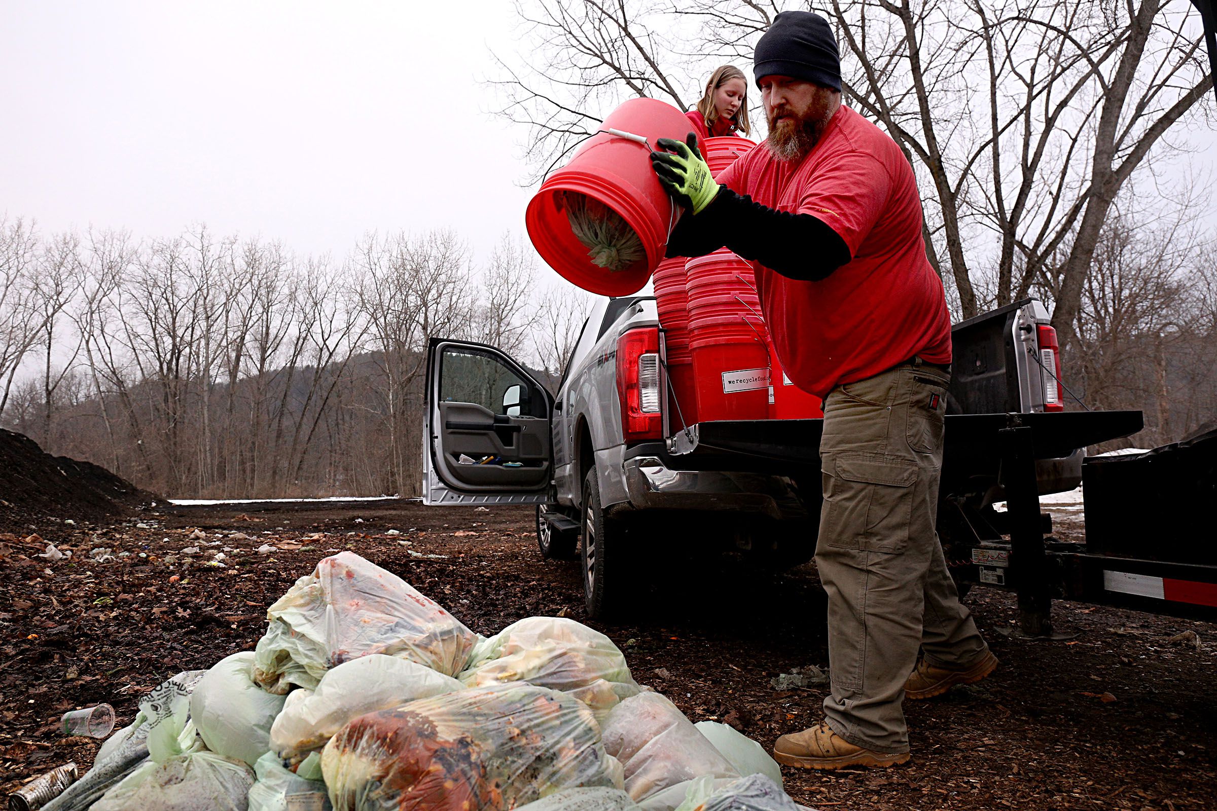 Joshua Dickey, who is General Manager for Nordic Waste Services in Lebanon, N.H., drops a load of compost with his daughter Lydia's help at the landfill in West Lebanon on Jan. 14, 2021. The company's We Recycle Food program offers weekly curbside, drop-off and commercial services for composting. (Valley News - Geoff Hansen) Copyright Valley News. May not be reprinted or used online without permission. Send requests to permission@vnews.com.