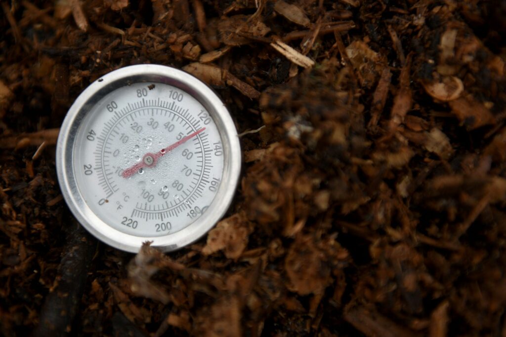 Jen Murphy of Willow Tree Community Compost monitors the temperature of her compost bins in Wilder, Vt., on Thursday, March 25, 2021. (Valley News - Jennifer Hauck) Copyright Valley News. May not be reprinted or used online without permission. Send requests to permission@vnews.com.
