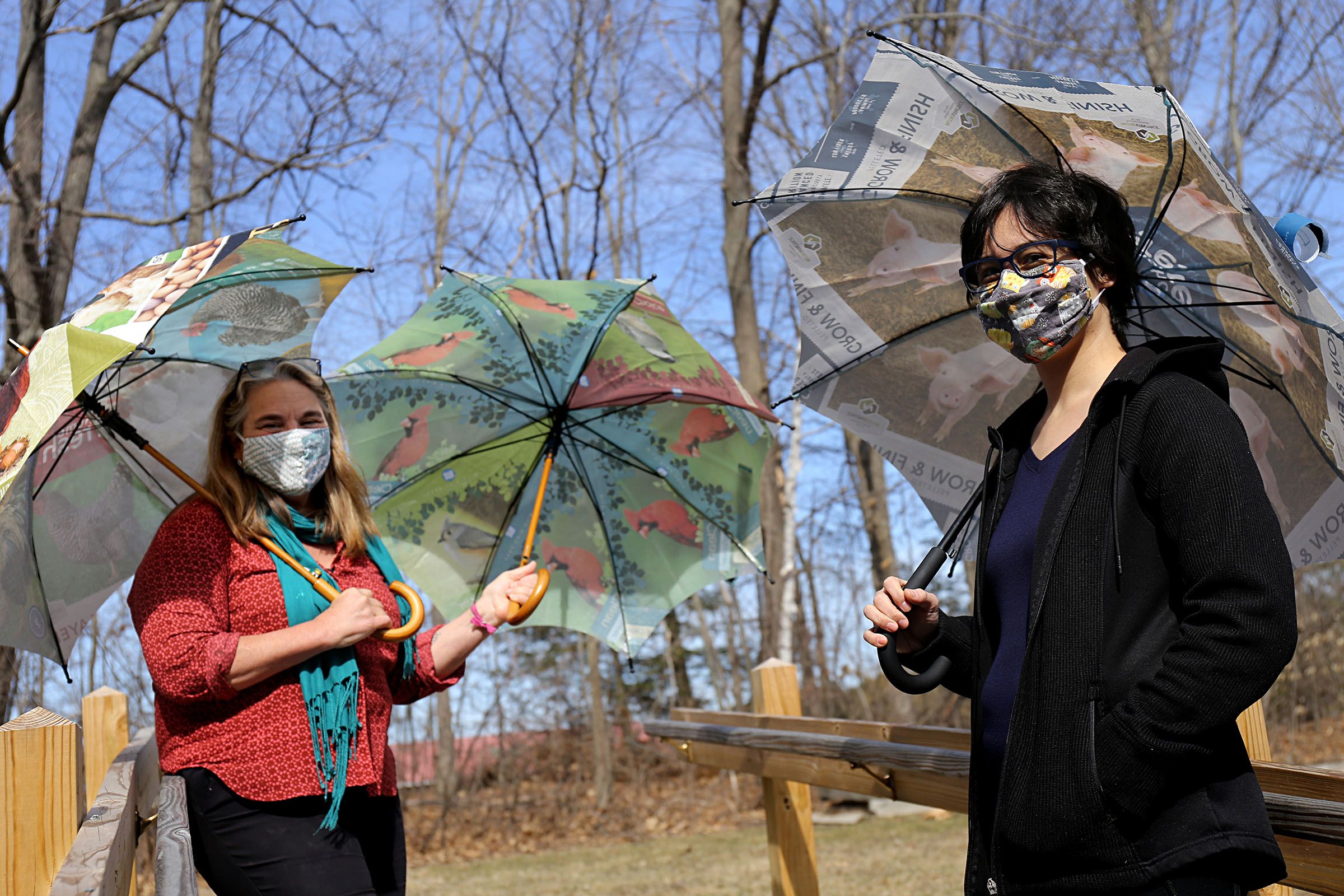 Families Learning Together participant Cherylynn Calfy, right, and Studio Worksite Supervisor Julia Dickenson display three of the over 200 umbrellas made from 50 lb. grain and birdseed bags at The Family Place in Wilder, Vt., on March 25, 2021. Over the past two years, participants in the Farm to Bag shop have made umbrellas and bags from recycled materials. "It's all about pushing skills forward," Dickenson said of the program. (Valley News - Geoff Hansen) Copyright Valley News. May not be reprinted or used online without permission. Send requests to permission@vnews.com.