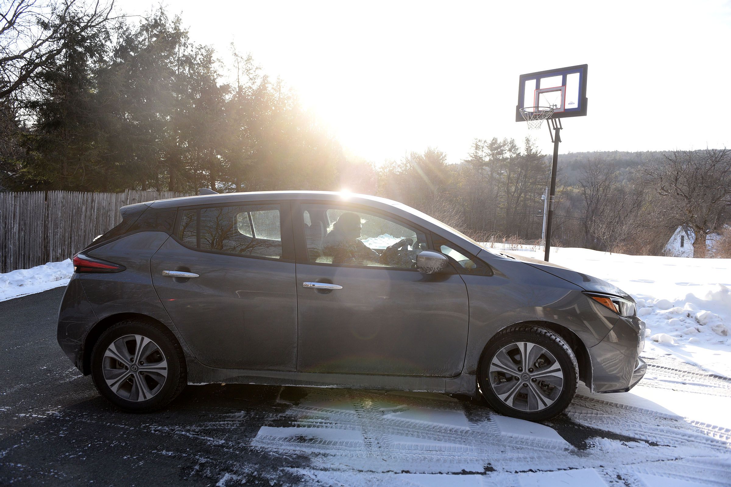 Julie Davis, of Lyme, N.H., heads for work in her new electric car on Wednesday, Feb. 3, 2021. ( Valley News - Jennifer Hauck) Copyright Valley News. May not be reprinted or used online without permission. Send requests to permission@vnews.com.
