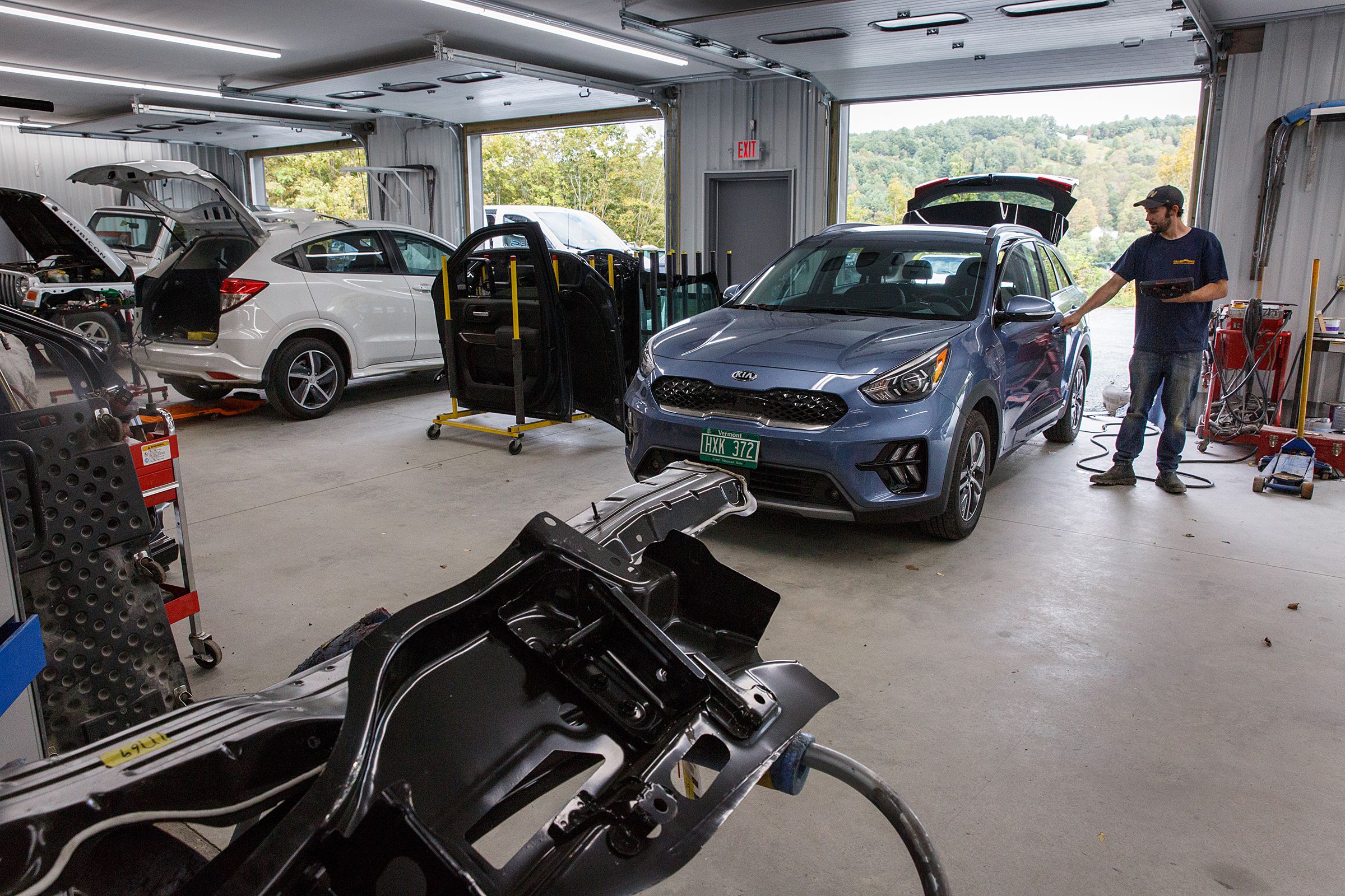 Technician Joe Matthews checks to make sure the electronics are functioning properly on a car at Collision Works in White River Junction, Vt., on Thursday, Sept. 23, 2021. (Valley News / Report For America - Alex Driehaus) Copyright Valley News. May not be reprinted or used online without permission. Send requests to permission@vnews.com.