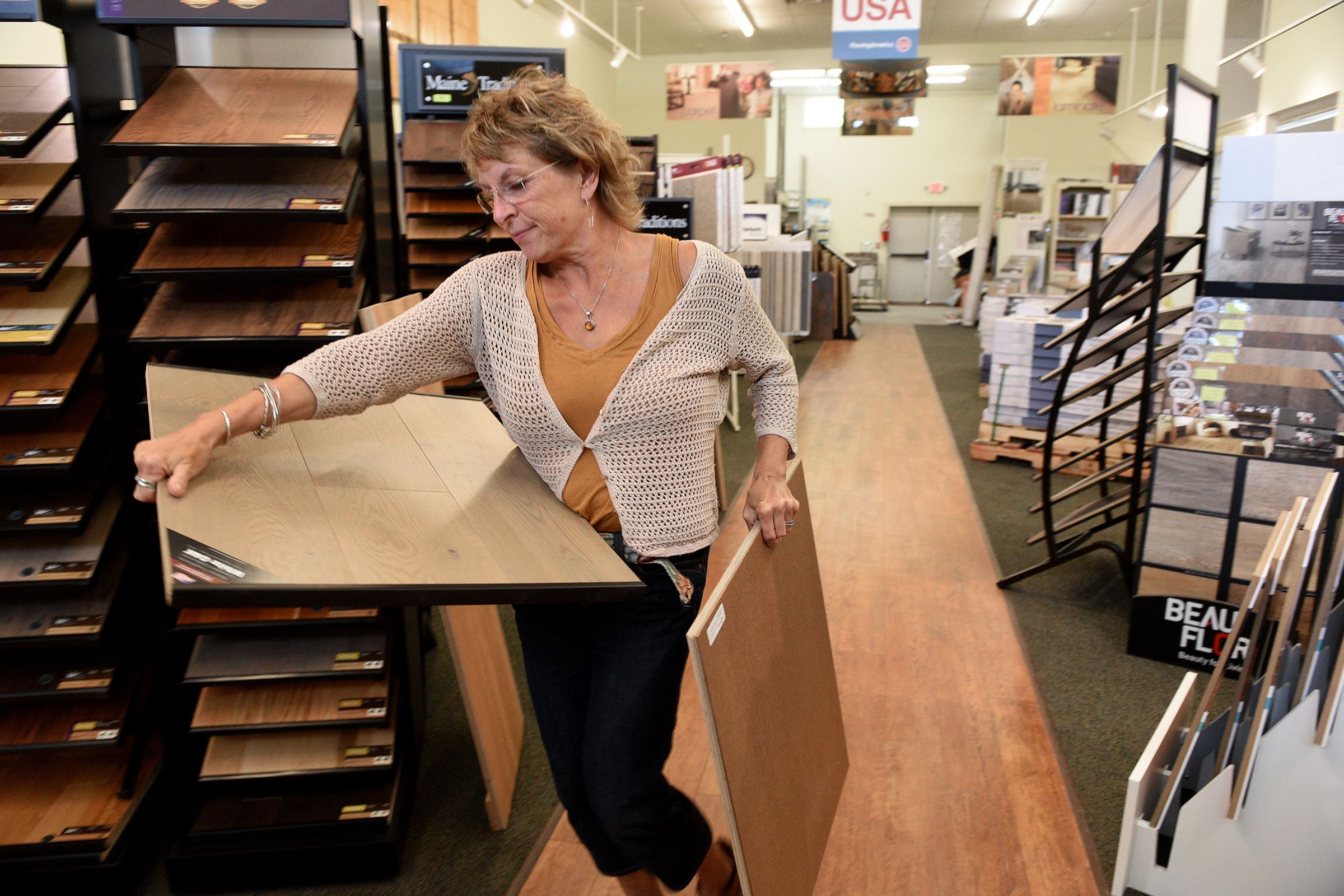 Kitchen designer Sheila Varnese grabs a couple samples for a client at LaValley Building Supply in West Lebanon, N.H., on Wednesday, June 29, 2022. ( Valley News - Jennifer Hauck) Copyright Valley News. May not be reprinted or used online without permission. Send requests to permission@vnews.com.