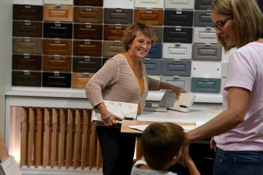 At LaValley Building Supply, kitchen designer Sheila Varnese works with client Stephanie Biebell, and her son Oliver, 4, of Windsor, Vt., on Wednesday, June 29, 2022. in West Lebanon, N.H. ( Valley News - Jennifer Hauck) Copyright Valley News. May not be reprinted or used online without permission. Send requests to permission@vnews.com.