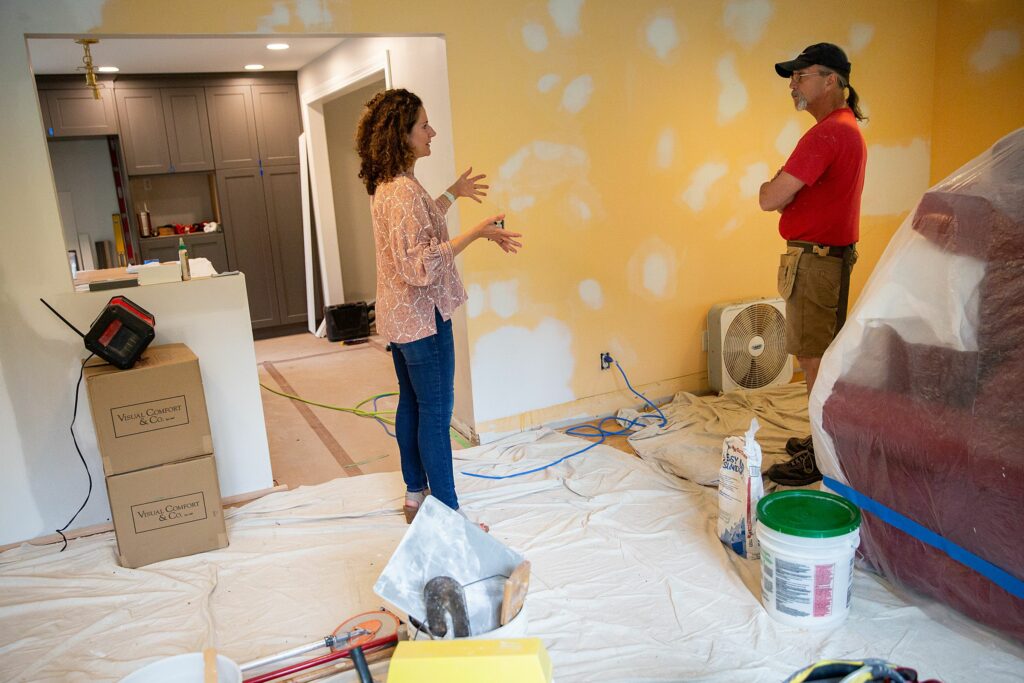 Interior designer Jessica Bell, left, talks to contractor Richard Monica at a client’s home in Hanover, N.H., on Tuesday, June 21, 2022. Bell worked with Nelson Lavelle from Kitchens of Distinction in White River Junction, Vt., to design the home’s kitchen and said that working collaboratively and “tapping into other people’s creativity” is one of her favorite parts of the job. (Valley News / Report For America - Alex Driehaus) Copyright Valley News. May not be reprinted or used online without permission. Send requests to permission@vnews.com.