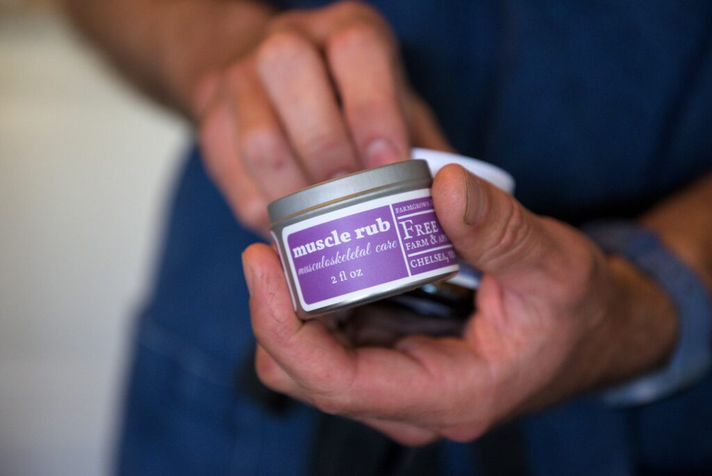 Misha Johnson of Free Verse Farm and Apothecary sells several body care balms and creams at the company's store in Chelsea, Vt., on Tuesday, June 28, 2022. (Valley News - James M. Patterson) Copyright Valley News. May not be reprinted or used online without permission. Send requests to permission@vnews.com.