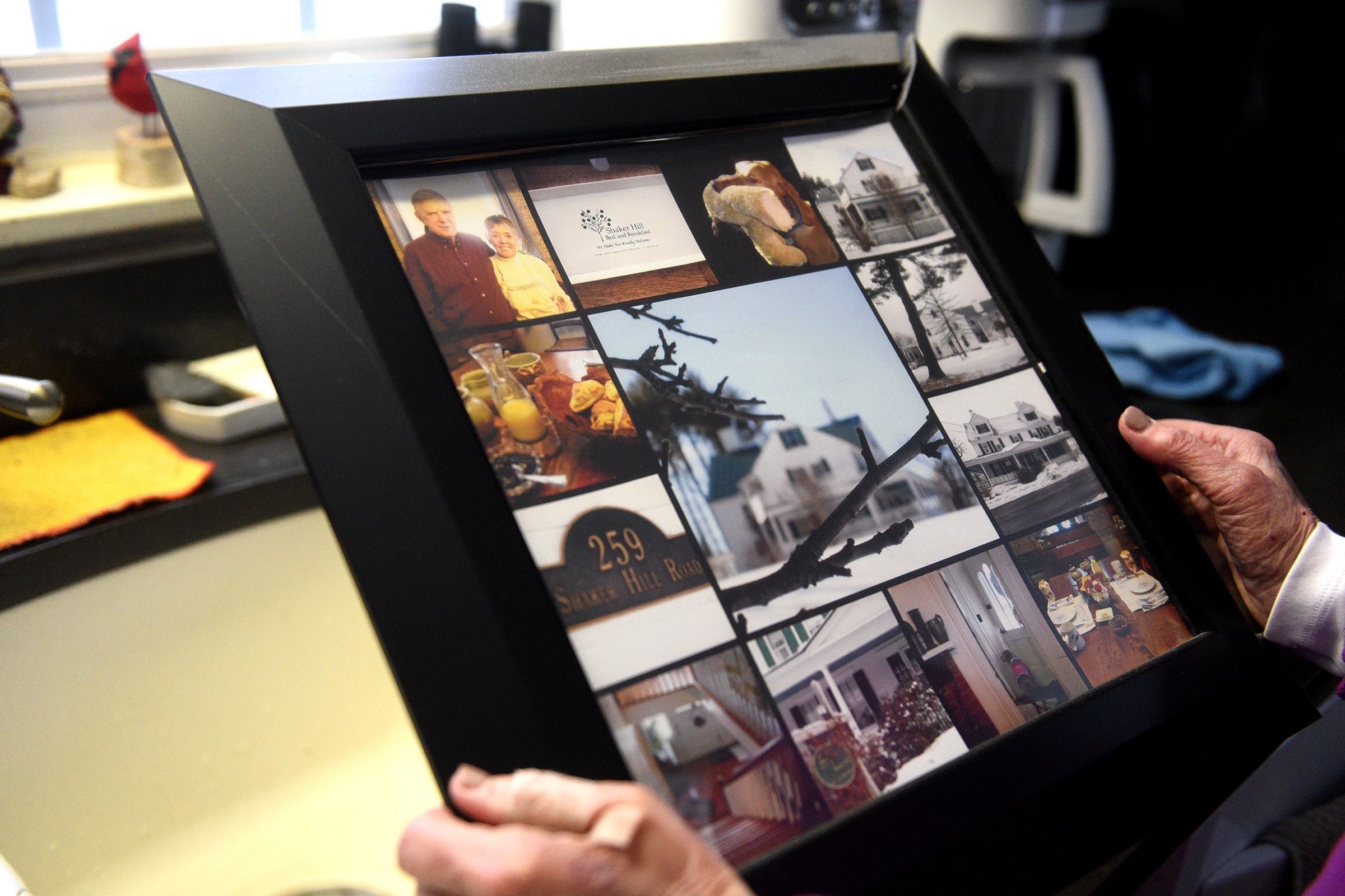 Nancy Smith, owner of the Shaker Hill Inn Bed and Breakfast, looks at photographs a guest sent her after a stay at her inn. Smith was home on Thursday, Jan. 12, 2023, in Enfield, N.H. (Valley News - Jennifer Hauck) Copyright Valley News. May not be reprinted or used online without permission. Send requests to permission@vnews.com.